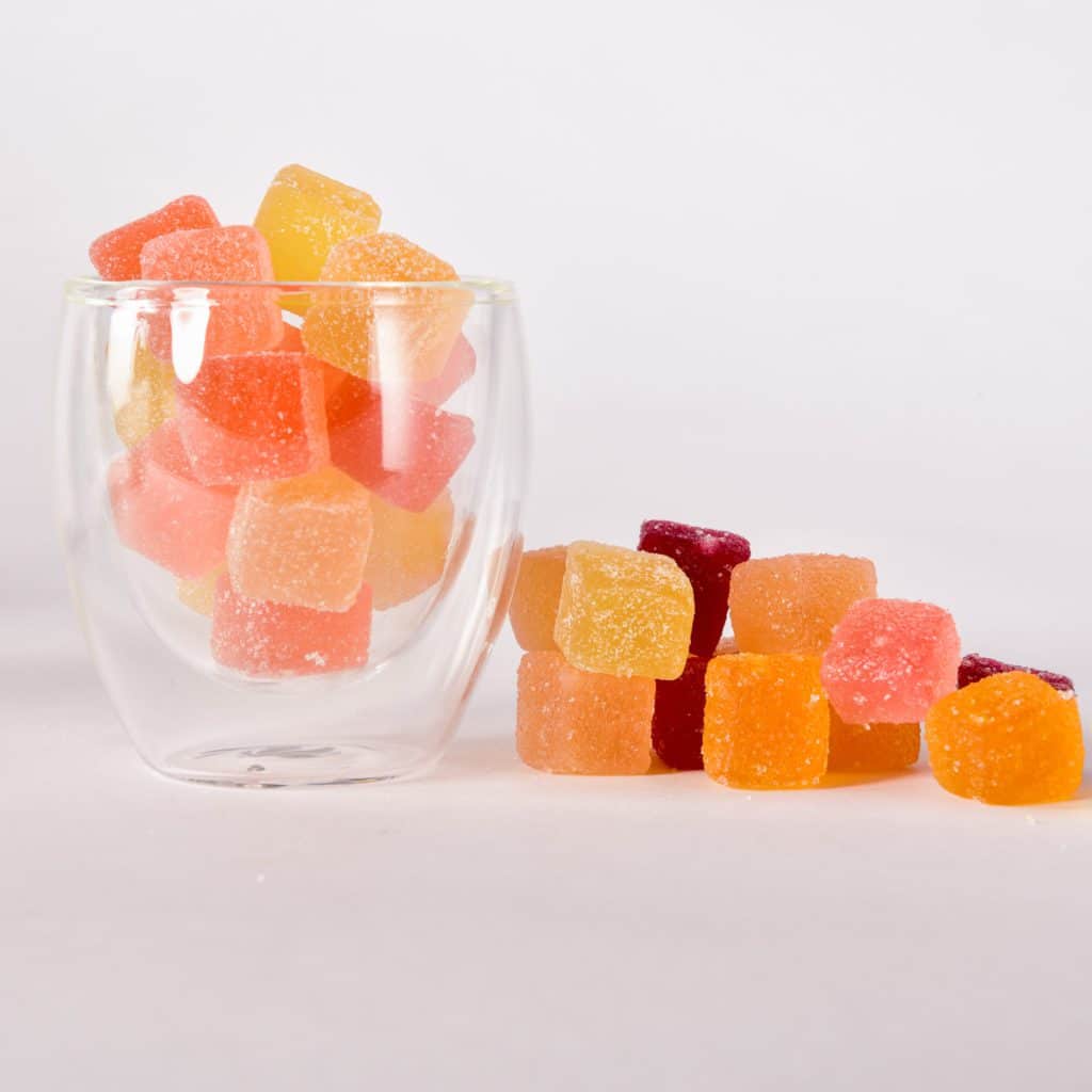 Assorted-flavors-CBD-infused-gummies-300-MG-Dani-Pepper-glass-2